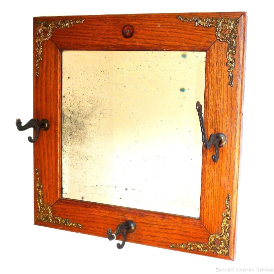19'' x 20'' decorative mirror with hanger brackets. Mirror has wooden frame around it that is in