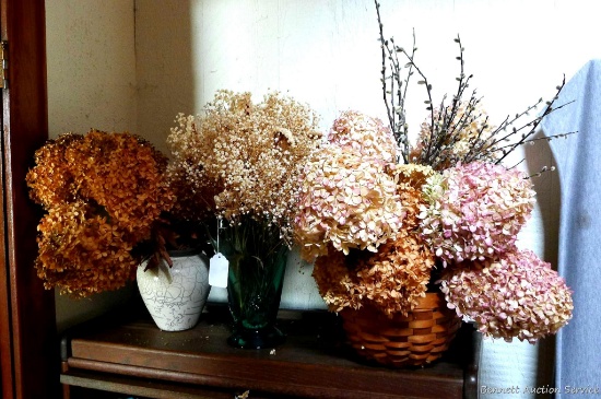 Pretty dried flower arrangements with basket and two vases. Largest vase measures 11'' tall, basket
