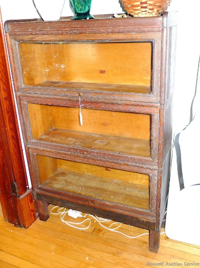 Barrister's bookcase measures approx. 54'' x 34'' x 12''. Framed glass doors slide up and tuck into