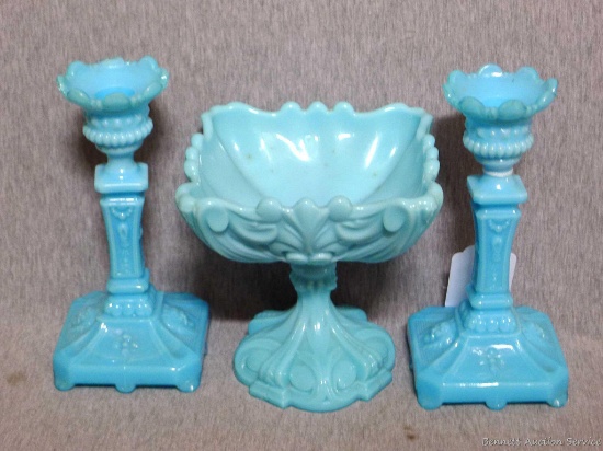 Pretty blue glass candle stick holders and footed dish sideboard set. Taller pieces measure 8''.