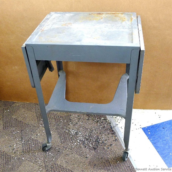 Little rolling table has two 9" leaves and stands about 18" x 15" x 27" high. Very handy.