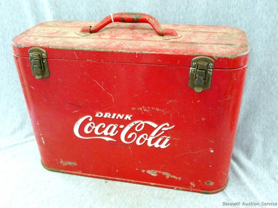 Cool vintage Coca-Cola metal cooler. The piece has some wear, paint chips, and rust spots, but is in