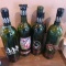 Four Dead Red wine bottles are each 12