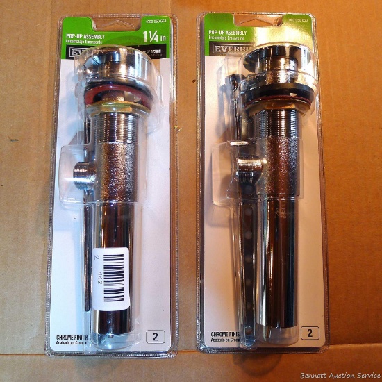 Two new in package EverBilt 1-1/4" pop up drain assemblies.