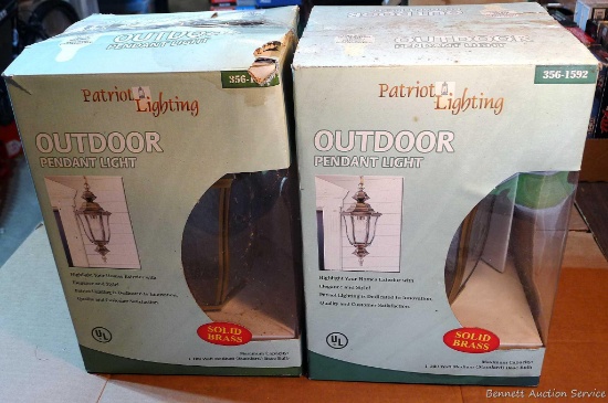 Two new in package Patriot Lighting outdoor pendant lights. Box notes dimensions " wide x 18-1/4"