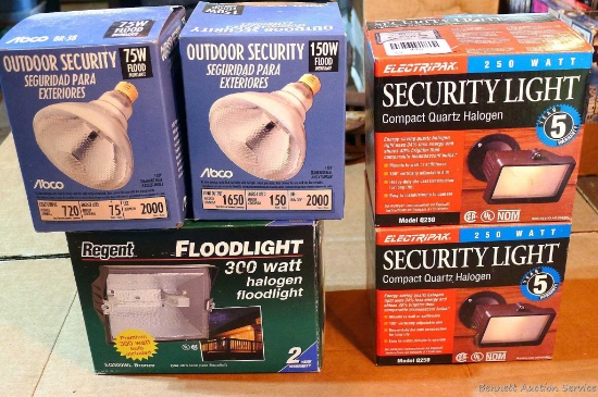 Two new in package ElectriPak security lights, one halogen floodlight and two outdoor security