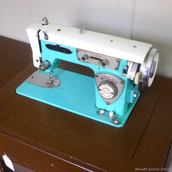 Very vintage aqua Fleetwood Precision Bilt Deluxe sewing machine in original cabinet. Beautiful