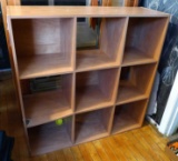 Cubby-style shelf measures 3' x 3' x 1'. Middle left shelf is broken - could easily be removed for a