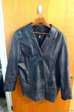 Men's leather jacket is size 24W and in good condition.