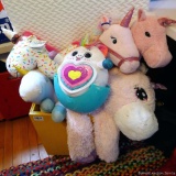 Large stuffed unicorn by HugFun is approx. 2-1/2' long. Other stuffed unicorns, two stick unicorns.