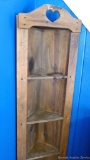 Wooden corner cabinet with 4 shelves and 1 door; measures 16