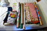 Gift wrap and other wrapping supplies in a long tote; measures 16-1/2
