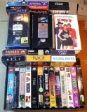 VHS tapes including Hot Shots, Jurassic Park, Fried Green Tomatoes, RoboCop 1-3, Father of the Bride