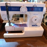 Newer White heavy duty sewing machine; older Sears Kenmore sewing machine. Missing cords and pedals.