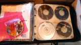 CD case filled with discs by Kiss, Grateful Dead, SoundGarden, Metallica, MegaDeath, Pink Floyd,