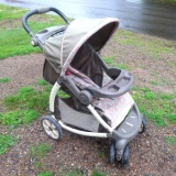 Graco stroller with nice large wheels; opened its overall measurement is 23