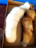 Two fox tails; each measures 17