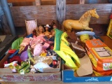 Vintage Barbie dolls, horse with saddle and bridle, clothes, blow up furniture that also includes a