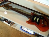 Electric guitar with custom paint job, needs new strings.