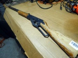 Vintage Daisy pellet gun with wooden stock.