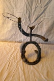 Metal cowboy sculpted from horseshoes; measures 8