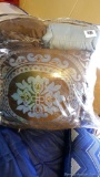 Two full/queen comforter sets that include shams and throw pillows.