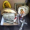 Collection of religious decor. Images of Jesus, crucifix, angel figurines, and more. Largest piece