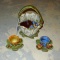 Located at alternate address in Prentice. Pretty glazed pottery basket and two matching votive