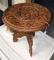 Located at alternate address in Prentice. Intricately carved collapsible stool measures 12' x 12'