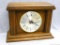 Wooden mantle clock, in nice condition. Needs batteries for operation. Measures 11'' x 14 1/2'' x