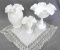 Fenton or similar milk glass vases, pedestal dish, and decorative cloth. All are in good condition.