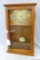Simple quartz clock is low maintenance and in good condition. Seller notes runs. Cabinet is about