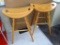 Two nice looking saddle-style stools are in good shape and stand 32