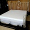 Rustically ornate king size bed frame is in good condition. Headboard stands approx. 5' 3
