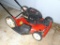 Located at alternate address in Prentice. Poulan Pro, 5 hp 22'' self propelled lawn mower. Tank is