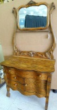 Solid wood washstand has dresser harp with tilting beveled glass mirror. Washstand has three
