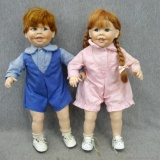 Little boy and little girl porcelain doll, each about 15