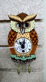 Wacky miniature owl clock is marked Germany on face. Measures about 4-3/4