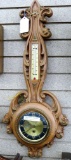 Vintage thermometer-clock with key, seller notes runs. Measures about 27'' long and is in good