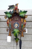 Seller notes musical colored cuckoo clock, runs. Face marked Germany, cabinet measures about 14''