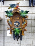 Colored cuckoo clock, seller notes this musical cuckoo clock runs. Face is marked Germany. Measures