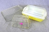 Pyrex glass covered dish, glass refrigerator storage container, and butter dish. All glassware in