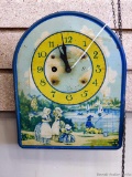 Vintage Irving Miller Co. clock was made in U.S.A. and measures 9'' long. Metal clock comes with