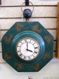 Vintage Onyx Novelty Co. wall clock has a wooden body and is about 18