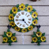 Trendy vintage cast metal sunflower clock comes with two accent wall hangings. Clock about 9