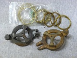 Two watchmaker-clockmakers-horologist cast clock mainspring winders and several coils of wire.