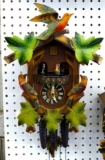 Colorful dancing cuckoo clock has a face marked W-Germany. Measures about 15
