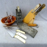 Wooden nut bowl with picks and crackers, cheese graters, Farberware knife block with assorted
