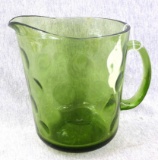 Retro green glass pitcher is about 7