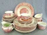 Red and cream Currier and Ives and other dishes incl cups, saucers, dinner plates, serving bowl,